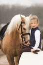 Beautiful Girl love horse in farm. park on background