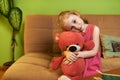 Beautiful girl loves teddy bear