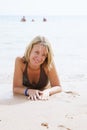 Beautiful girl lying on the beach Royalty Free Stock Photo