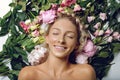 Beautiful girl lying in flowers Royalty Free Stock Photo