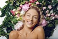 Beautiful girl lying in flowers Royalty Free Stock Photo