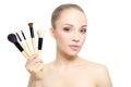 Beautiful girl with makeup brushes isolated on white Royalty Free Stock Photo