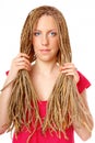 Beautiful girl many plaits hairstyle holding hair