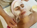 Beautiful girl, mask cosmetic in spa salon cosmetology procedure, relaxation young