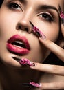 Beautiful girl in mask with long nails and sensual lips. Beauty face. Royalty Free Stock Photo