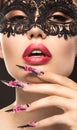 Beautiful girl in mask with long nails and sensual Royalty Free Stock Photo