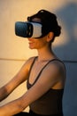Beautiful girl meditates in the digital universe. Fitness of the future. Innovations. Virtual reality. VR glasses.