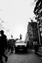 Beautiful girl with megaphone standing on the top of the van in front of the Huge crowd of Black Lives Matters protesters heading