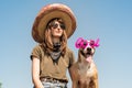 Beautiful girl in mexican hat dressed up as bandit of gangster w