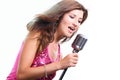Beautiful girl with a microphone singing a song