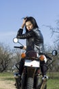 The beautiful girl on a motorcycle