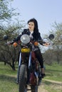 The beautiful girl on a motorcycle