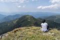 Beautiful girl in the mountains. An incredible view of the Troyan Balkan. The mountain captivates with its beauty, fresh air.