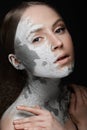 Beautiful girl with mud on his face. Cosmetic mask. Beauty face. Royalty Free Stock Photo