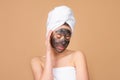 Beautiful girl with mud on his face. Cosmetic mask. Beauty face. Mud facial mask, face clay mask spa. Beautiful woman Royalty Free Stock Photo