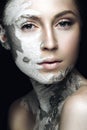 Beautiful girl with mud on his face. Cosmetic mask. Beauty face. Royalty Free Stock Photo