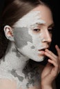 Beautiful girl with mud on his face. Cosmetic mask. Beauty face. Royalty Free Stock Photo