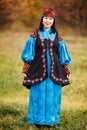 Beautiful girl in national dress smartly blue with