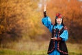 Beautiful girl in national dress smartly blue with Royalty Free Stock Photo