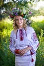 Beautiful girl in national Ukrainian embroidery shirt and wreat Royalty Free Stock Photo