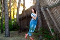 Beautiful girl near an old wooden fence Royalty Free Stock Photo