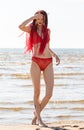 Girl in a red bathing suit on the beach Royalty Free Stock Photo