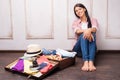 Beautiful girl packing her suitcase Royalty Free Stock Photo