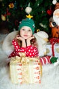 Beautiful girl in pajamas with gift box is waiting Christmas and New year Royalty Free Stock Photo