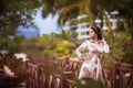 Beautiful girl in palm leaves