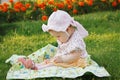 Beautiful girl in panama sitting on flowers meadow Royalty Free Stock Photo