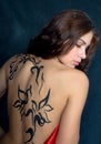 A beautiful girl with a pattern on its back Royalty Free Stock Photo