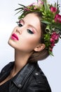 Beautiful girl with perfect skin and bright floral wreath on her head. Royalty Free Stock Photo