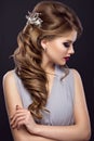 Beautiful girl with perfect skin, evening make-up, wedding hairstyle and accessories. Beauty face.