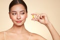 Beautiful Girl With Pill With Cod Liver Oil Omega-3 Royalty Free Stock Photo