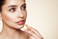 Beautiful Girl With Pill With Cod Liver Oil Omega-3 Royalty Free Stock Photo