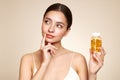 Beautiful Girl With Pill With Cod Liver Oil Omega-3 Royalty Free Stock Photo