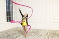 Beautiful girl with Pink Rhythmic gymnastics ribbon Royalty Free Stock Photo