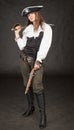 Beautiful girl - pirate with sabre and pistol Royalty Free Stock Photo