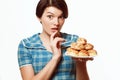 Beautiful girl with a plate of bakery products, diet, calories