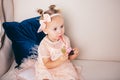 Beautiful girl playing with cupcake. Birthday baby. Model, happy. Little girl with cake. Childhood. Little child girl in a Royalty Free Stock Photo