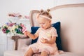 Beautiful girl playing with cupcake. Birthday baby. Model, happy. Little girl with cake. Childhood. Little child girl in a Royalty Free Stock Photo