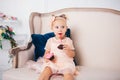 Beautiful girl playing with cupcake. Birthday baby. Model, happy. Little girl with cake. Childhood. Little child girl in a Royalty Free Stock Photo