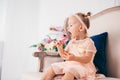 Beautiful girl playing with cupcake. Birthday baby. Model, happy. Little girl with cake. Childhood. Little child girl in a Royalty Free Stock Photo