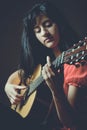 Beautiful girl playing guitar Royalty Free Stock Photo