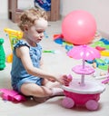 Beautiful girl plays toys