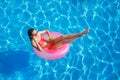 Beautiful girl in the pool on inflatable lifebuoy Royalty Free Stock Photo