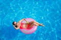 Beautiful girl in the pool on inflatable lifebuoy Royalty Free Stock Photo