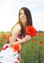 Beautiful girl in the poppy field. Royalty Free Stock Photo