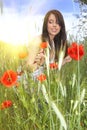 Beautiful girl in the poppy field. Royalty Free Stock Photo