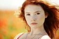 Beautiful girl in poppy field Royalty Free Stock Photo